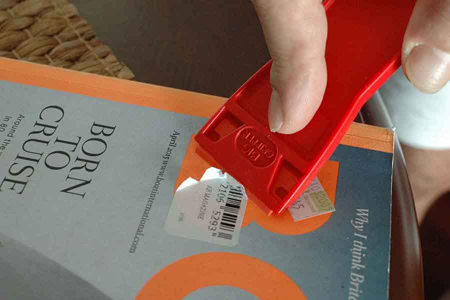 Book Labels stiker removal with Scraperite plastic safety scrapers